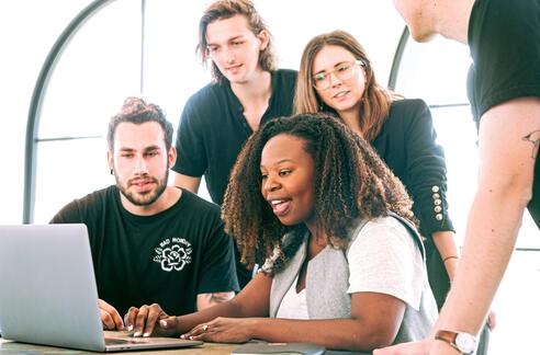 Team Working Around Computer Photo